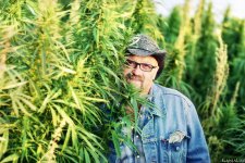 marijuana-cultivator-posing-with-plants-cannabis-getty.jpg